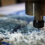 Metallic detail of lathe machine over working surface